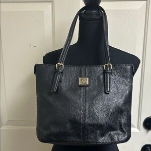Anne Klein Black leather Tote with size pocket and adjustable straps. 13”x9 1/2”